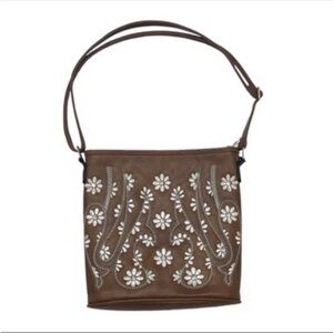 Tan carry bag with adjustable strap and embroidered daisy print